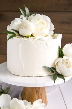 there is a white cake with flowers on it