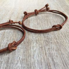 Brown Leather matching bracelets These lovely bracelets are made with genuine leather cord. Designed for couples Both bracelets are adjustable Includes: Gift Box + 2 Bracelets Note: Not Waterproof Please feel free to contact me if you have any questions These bracelet will be shipped by USPS as soon as the payment is been received. Casual Leather Bracelet As Gift, Casual Leather Jewelry As Gift, Couples Adjustable Friendship Bracelets, Adjustable Couples Friendship Bracelets, Minimalist Leather Braided Bracelets, Minimalist Adjustable Leather Braided Bracelets, Adjustable Minimalist Leather Braided Bracelet, Gift Brown Braided Bracelets With Sliding Knot, Brown Leather Bracelet With Adjustable Length As Gift