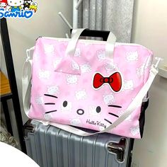 Nip Sanrio’s Hello Kitty Weekender Bag Kawaii Travel Bag With Zipper Closure, Hello Kitty Print Travel Shoulder Bag, White Shoulder Travel Bag For School, White Hello Kitty Print Bag For Daily Use, Rectangular Hello Kitty Shoulder Bag For Travel, White Hello Kitty Print Shopping Bag, Hello Kitty Print Shoulder Bag For Travel, Cute Hello Kitty Shoulder Bag For Travel, White Hello Kitty Shopping Bag