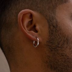 A large 18MM Hoop designed for Men. 925 Sterling Silver Hoop Earring is a simple Large Hoop. The Earring hangs just below the ear for a stylish & classic Look. Also available in 18K Gold. Materials: 925 Sterling Silver / 18K Gold Plating Size: 18mm Circumference Closure: Ear wire Bar size: 1mm (Gauge)  Perfect for Daily wear These earrings are not included within our lifetime warranty. The 18K Gold Plating will tarnish after 1-2 years. We suggest avoiding contact with water & chemicals. Please n Men Silver Hoop Earrings, Mens Gold Hoop Earrings, Mens Hoop Earrings, Punk Tactics, Hoop Earrings For Men, Men's Piercings, Silver Hoop Earring, Large Silver Hoop Earrings, Mens Earrings Hoop