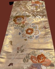 Shipping Free Vintage Japanese Obi (kimono sash) 100％silk, Calm Gold Base, Beautifully Embroidered Flowers Pattern 0503-0088 On this Obi, the total colors look bright because of the base gold color nuance which is not yellow gold but whiter gold.  The embroidery is neat and skillful. The atmosphere of this Obi is elegant and tender because of the colors despite of big flowers embroidery.  Please appreciate Japanese elegance and chicness having this obi in your hands. We offer a set of a hanger and a pair of weights for Obi hanging decoration for a set price.  Please see below for ** Set of Obi Decoration Hunger and Weights, and item No.03-0100 for photos of the set.        Fukuro-Obi (One side pattern) Rokutsu- Gara ( Main pattern on approximately 60% of the front side ) Back side (another Elegant Embroidered Silk Kimono, Traditional Silk Kimono For Festivals, Elegant Gold Kimono For Ceremonial Occasions, Obi One, Obi Kimono, Japanese Obi, Japanese Colors, Flowers Embroidery, Japanese Porcelain