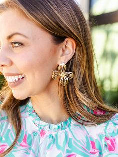 Blossom into spring with our timeless Alani Earrings. Featuring an organic shaped flower stud, these earrings introduce a delicate touch of floral sophistication to your everyday outfit. Organic shaped flower stud earrings 2.25" Brass plated Hypoallergenic Surgical steel posts Nickel and lead-free Feminine Drop Earrings For Spring, Elegant Spring Petal Shaped Flower Earrings, Gold Flower Earrings For Spring, Chic Spring Flower Earrings For Pierced Ears, Feminine Petal-shaped Jewelry For Spring, Feminine Flower Shaped Jewelry For Spring, Feminine Flower-shaped Jewelry For Spring, Feminine Spring Flower-shaped Jewelry, Chic Petal-shaped Earrings For Gift