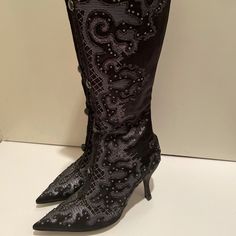 Gorgeous Ballin Boots Sz 36.5. The Inside Of The Boots Are Leather But The Outside Is A Satin Material With Sparkle. Black Rhinestones Down The Front. Back Zip. Never Worn! Please Note The Top Rhinestone On The Right Boot Is Missing But It’s Barely Noticeable. I’d Remove The One Off The Left Boot Just To Be Even. The Border On The Top Of The Right Shoe Is Also A Little Off As Shown In The Picture. Heel Height Is 3 And 1/2 Inches. Truly Stunning! Evening Heeled Boots With Rhinestones, Fall Embellished Heeled Boots For Formal Occasions, Chic Embellished Heeled Boots For Formal Occasions, Chic Embellished Heeled Boots For Evening, Fall Formal Embellished Heeled Boots, Rhinestone Knee-high Evening Boots, Knee-high Evening Boots With Rhinestones, Knee-high Rhinestone Boots For Evening, Black Embellished Heeled Boots For Party