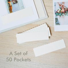 a set of 50 pocket cards with flowers on the front and back, next to a photo frame