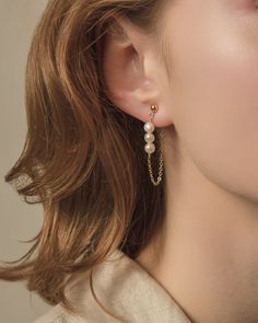 These elegant earrings really sparkle! Each earring has three tiny, rare pearls with a dainty chain attached to the minimal ball stud at the front and to the back of the earring so you never lose the studs!  * Buy 2 or more items and receive 25% off your order, no code required!  Details  * Stud earrings / chain: 925 sterling silver gold-plated  * Natural freshwater pearls  * Pearl size: approx. 4-5mm  * Earrings with chain: approx. 4cm hanging  ‼️As this is a natural product, the color and sizes of the pearls may vary slightly. Hardly any pearl will have a completely perfect surface. Small irregularities and growth features are sure to be found on each pearl.  ✨SHIPPING  * Ready for dispatch in 1-3 working days  * Your order will be lovingly sent in a package  ✨CARE TIPS  Your jewelry sho Bridal Jewelry Gold, Earrings With Chain, Gold Bridal Jewelry, Rare Pearls, Pearl Earrings Gold, Earrings With Pearls, Earrings Chain, Front Back Earrings, Pearls Jewelry