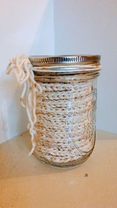 a mason jar with rope wrapped around it