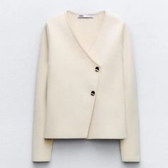 Long Sleeve Collarless Blazer With V-Neckline. Front Asymmetric Wrap Closure With Gold Buttons. Vanilla Chic Spring V-neck Sweater For Workwear, Elegant V-neck Winter Outerwear, Chic Winter V-neck Blazer, Chic Fall Blazer With V-neck, Chic V-neck Blazer For Fall, Zara V-neck Sweater For Work, Cream V-neck Outerwear For Work, Chic Beige V-neck Sweater For Layering, Elegant Beige V-neck Sweater For Winter