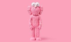 a pink monster figure with two eyes on it's head and one hand up to his face