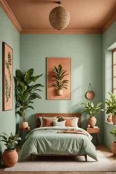 a bedroom with green walls and potted plants