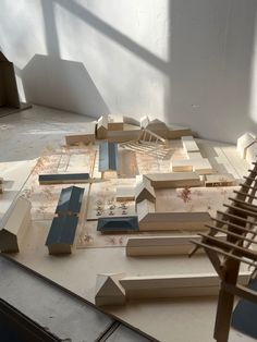 a model of a city with buildings on the ground