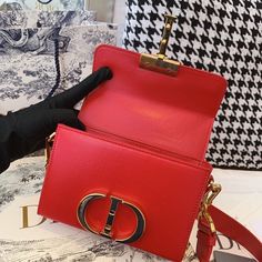 CHRSTN DR Mini 30 Montaigne Bag Gold toned hardware Red For Women 18cm/7in CD Rep 1:1 Measurements: 18 x 5 x 11.5 cm / 7 x 2 x 4.5 inches The 30 Montaigne line, inspired by the hallmark address, offers essential pieces that embody the House’s iconic codes. The handbag is crafted in blue-gray box and embellished with a flap with an antique gold-finish metal ‘CD��’ clasp, inspired by the seal of a CHRSTN DR perfume bottle. The miniature style has an adjustable shoulder strap and ca Dior Perfume Bottle, Christian Dior Perfume, Dior Perfume, Luxury Products, Belt Accessories, Evening Clutch Bag, Sierra Leone, Perfume Bottle, Tote Backpack