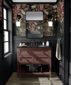 a bathroom with black walls and floral wallpaper on the vanity, along with two mirrors