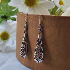 Victorian Filigree Teardrop Dangle Earrings are crafted of sterling silver. These earrings are 1.75" long and 1/2" wide and weigh about 6.7 grams. This is vintage, unworn overstock.  Orders will ship out in 1-3 business days from my Ozark studio. In addition to your jewelry, you'll receive a polishing cloth and silver care instructions card. If you have any questions, please send me a message. I'm happy to help :) ABOUT PROSEBUD -------------------------------------- Prosebud is located in the A Gothic Dark Academia, Perfume Jewelry, Clean Sterling Silver, Teardrop Dangle Earrings, Filigree Earrings, Deco Jewelry, Art Deco Jewelry, Dark Academia, Vintage Charms