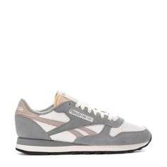 This Reebok Classic Leather is the most stylish and timeless sneaker to hit shelves. Featuring lightweight cushioning and a low-cut design, this casual men's sneaker is perfect for all-day wearing and versatile styling. Dress this sneaker up in slacks, or dress them down with sweatpants and a fitted tee. Soft leather upper. Removable sockliner accommodates orthotics. Die-cut EVA midsole for lightweight cushioning. High abrasion rubber gum outsole for durability. Imported. 80s Sneakers, Reebok Classic Leather Sneakers, Grey Trainers, Reebok Classic Leather, Black And White Sneakers, Cross Training Shoes, Black Trainers, Reebok Classic, Previous Life