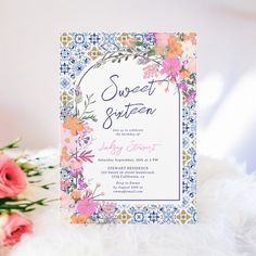 a card with flowers on it next to some pink roses