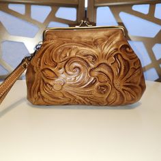 Patricia Nash Tooled Leather Wristlet. 2 Inside Credit Card Slots, One Inside Slip Pocket & Zip Pocket. Never Used. 6.5"H 8.5"L Handheld Zipper Pouch, Daily Use Coin Purse Clutch, Elegant Brown Leather Wristlet, Brown Coin Purse For Everyday Use, Elegant Leather Clutch With Hand Tooled Details, Brown Handheld Clutch As A Gift, Brown Handheld Clutch As Gift, Handheld Wallets As Gifts, Elegant Brown Clutch With Wrist Strap