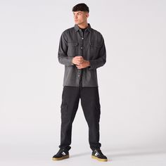 "Our Denim Cargo Overshirt is a versatile layering piece with an oversized fit, button front, two chest pockets, long sleeves, and a point collar. Its edgy vibe can enhance any outfit, whether paired with jeans, chinos, or joggers for a casual look, or a shirt and tie for a smarter appearance. This stylish and functional overshirt is an excellent addition to any man's wardrobe. Product Features: Grey wash Oversized fit Button front fastening 2 Cargo chest pockets Long sleeve Point collar 100% Cotton Our Model is 5'8\" and Wears Size 8. To find the perfect fit for yourself check our Size Guide. Size = S - XXL Chest = 56cm - 66cm Sleeve Length = 63cm - 67cm Total Length = 76cm - 80cm Chest Is Measured Armpit to Armpit.                         Sleeve Length Is Measured Shoulder To Cuff. Casual Button-up Top With Cargo Pockets, Utility Button-up Shirt For Streetwear, Button-up Washed Tops For Streetwear, Urban Button-up Shirt For Streetwear, Streetwear Button-up Tops With Cargo Pockets, Washed Black Button-up Shirt With Pockets, Denim Shirt Men, Denim Cargo, Cargo Shirts