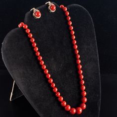 Vintage 1960's 18k Yellow Gold Natural AAA Red Coral Necklace Earring Set 57.37gMetal Information: 18k Yellow GoldTotal Weight: 57.37gNecklace Width: 12mm - 6.1mmNecklace Length: 25"Earring Dimensions: 18mm x 12.8mmCirca: 1960'sStone InformationMain StoneGem Type: CoralShape: Round Bead (12mm - 6.1mm)Color: RedClarity/Quality: AAANumber of Stones: 79Accent StonesGem Type: CoralShape: Oval Cabochon (18mm x 8.2mm)Color: RedClarity/Quality: AAANumber of Stones: 1Estimated Retail Price: $7690.00OUR Fine Jewelry Red Jewelry For Evening, Classic Red Coral Formal Jewelry, Classic Red Jewelry With Matching Earrings, Red Classic Jewelry With Matching Earrings, Elegant Red Coral Necklace For Formal Occasions, Elegant Red Coral Necklace For Formal Events, Red Costume Jewelry Sets For Formal Occasions, Elegant Yellow Gold Jewelry With Red Coral, Formal Red Round Beaded Jewelry