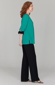 A perfectly simple blouse with beautiful tie cuffs. Always trimmed in black so it pairs easily with your favorite black pant. Featuring ¾ sleeves and a back neckline keyhole. Chic Blouse With 3/4 Roll-up Sleeves, Chic Blouse With Roll-up 3/4 Sleeves, Elegant 3/4 Sleeve Workwear Blouse, Elegant 3/4 Sleeve Blouse With Button Cuffs, Elegant 3/4 Sleeve Blouse For Work, Elegant Blouse With 3/4 Sleeves And Button Cuffs, Chic 3/4 Sleeve Blouse For Work, Elegant Formal Blouse With 3/4 Sleeves, Chic Half Sleeve Formal Blouse