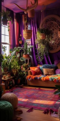 a living room filled with lots of plants and furniture