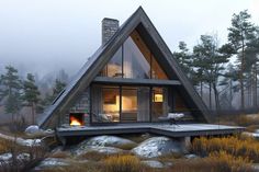 a - frame cabin in the woods with a fire place on the front and side