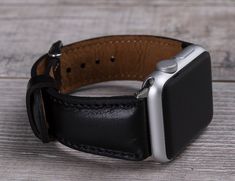 "Full grain leather black Apple watch strap for series 1-7 & SE. Wrist Sizes: Small for 135-175 mm (5.3\"-7\") wrists. Medium for 150-190 mm (5.9\"-7.6\") wrists. Large for 165-205mm (6.6\"-8.2\") wrists. X Large for 180-220 mm (7.2\"-8.8\") wrists. 2X Large for 195-235 mm (7.8\"-9.4\") wrists. Seven different color options for adapters (Silver, Black, Space Gray, Rose Gold, Yellow Gold, Red and Blue). Adapter color and buckle color will be same. Shipping takes usually 3-4 business days (via Black Bracelet Strap Apple Watch Band For Everyday, Black Leather Strap Apple Watch Band For Everyday Use, Black Rectangular Watch With Black Band, Black Rectangular Watch Bracelet Strap, Black Rectangular Watches With Leather Strap, Business Leather Apple Watch Band, Black Rectangular Watch Bracelet Strap Accessory, Black Rectangular Watch With Leather Strap, Black Rectangular Bracelet Strap Watch Band