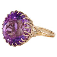 14 karat solid gold cocktail ring with genuine amethyst and diamonds. February birthstone. Total weight: 12.52 g. Central stone: Genuine amethyst Weight - approx 29.00 ct, round cut, purple-to violet color (little color change effect). Amethyst is tall, which is visible on photo on finger, transparent clarity. Diamonds: 12 pieces, weight - 0.12 ct (0.01 ct x 12 pieces) Round brilliant shape, SI clarity, H color. Diamond Danglers, Rose Gold Solitaire Ring, Amethyst Cocktail Ring, Mens Gold Wedding Band, Gold Link Bracelet, Violet Color, Gold Cocktail Ring, Gold Cocktail, Diamond Cocktail Rings