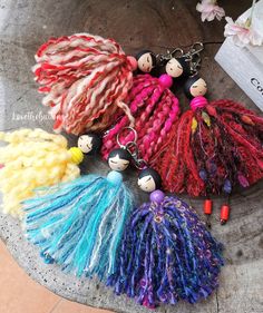 several different types of yarn and beads on a table