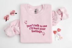 Don't Talk to Me Embroidered Sweatshirt, Y2K Style Embroidered Crewneck, Hurt Feelings Shirt, Gifts for Her, Gifts for Him, Couples Gifts, CozyGenZ - Dark grey sweatshirts will have black threads - Military Green and Maroon sweatshirts will have white threads This Cute Embroidered Don't Talk to Me I'll Hurt Your Feelings Sweatshirt is a must-have for your Valentines' Day or all season wardrobe. Whether you're running errands, going for a walk, attending a concert/party, or staying cozy at home, this unisex sweatshirt is perfect for you! Our crewnecks are made from the highest quality fabric for an incredibly soft and comfortable fit, with advanced printing to ensure that the colors and graphics are vibrant and detailed. ❤ The price is for ONE item only. If you want to order matching shirts Trendy Pink Sweatshirt With Embroidered Graphics, Pink Cotton Sweatshirt With Embroidered Graphics, Trendy Embroidered Pink Sweatshirt, Trendy Embroidered Long Sleeve T-shirt, Trendy Long Sleeve Embroidered T-shirt, Pink Long Sleeve Embroidered T-shirt, Pink Embroidered Long Sleeve T-shirt, Long Sleeve Embroidered Pink T-shirt, Sweatshirt Y2k