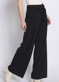 Super chic black wide leg pants with tie waist detail. Excellent quality material. Runs true to size. Model is wearing size small. Versatile Belted Wide Leg Pants, Chic High-waisted Pants With Tie Waist, Elegant Wide Leg Pants With Tie Waist For Spring, Chic High-waisted Tie Waist Pants, Elegant Spring Wide Leg Pants With Tie Waist, Elegant Belted Solid Wide Leg Pants, Elegant Solid Color Belted Wide Leg Pants, Chic Belted Bottoms For Date Night, Black Belted Wide Leg Bottoms