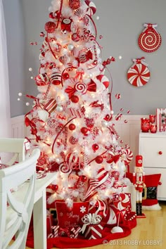 a red and white christmas tree decorated with candy canes