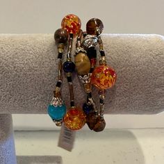 New With Tags. Measures 6.5” Plus Stretch. Brown, Orange With Yellow, Red, Pink, Blue, And Black Glass Beads W/ Silver Beads. Nice ! Check Out Other Items In My Closet! Over 2,000 Items- Mostly Jewelry! Bundle For The Best Discount! ( 20% Off For 2 Or More Items). Questions? Leave A Comment Below! Inv Note- J 8761 Pearl Cuff Bracelet, Pave Bracelet, Yellow Gems, Pearl Cuff, Elephant Bracelet, Gold Charm Bracelet, Gold Bracelet Cuff, Hinged Bracelet, Elastic Bracelet