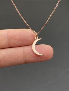 "18k Rose Gold Vermeil Crescent Moon Necklace Small, Minimalist and Dainty Moon Necklace Measurement: pendant height is 22mm (0.87\") including bail and 8mm (0.31\") wide Metal: All components are made from 18k Rose gold plated sterling silver (vermeil) Choose Chain Length At Checkout Please feel free to Convo me with any questions before purchasing. You can find other charm jewelry in my shop here https://www.etsy.com/shop/LinksAndStones?ref=seller-platform-mcnav&section_id=24389019 Please Rose Gold Crescent Necklace With Moon Charm, Rose Gold Crescent Moon Charm Necklace, Rose Gold Moon Phase Round Pendant Necklace, Minimalist Rose Gold Moon-shaped Jewelry, Rose Gold Moon Phase Necklace, Rose Gold Moon Necklace With Moon Charm, Rose Gold Moon Charm Necklace, Minimalist Rose Gold Necklace With Moon Charm, Minimalist Rose Gold Jewelry With Moon Charm