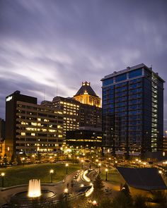 the city is lit up at night and it looks like there are lights on the buildings