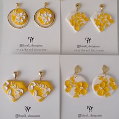 four yellow and white flowered earrings are shown in different shapes, sizes and colors