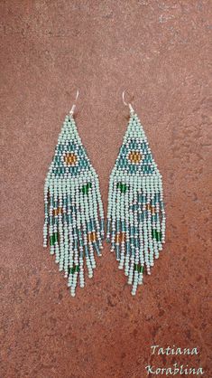 These handmade author's earrings are made of high-quality Czech beads and strong synthetic thread.In these unique earrings I use my author's scheme Vitrage flowers (Stained glass flowers) . Color: mint, blue,yellow,green,silver. I will make these earrings for you in your color. I beg you not to copy my authoring 100% hand made with love! Measurements: Length with hook - near 11 cm( 4,33 inch ),Width -3 cm (1.18 inch) Materials: Silver plated ear hooks Czech glass beads Tytan Thread Green Beaded Earrings For Festival, Artisan Green Beaded Earrings With Dangling Beads, Artisan Green Beaded Dangling Earrings, Handmade Green Beaded Earrings For Festivals, Green Dangling Bead Flower Earrings, Artisan Green Dangle Beaded Earrings, Green Beaded Flower Drop Earrings, Green Beaded Drop Flower Earrings, Handmade Green Dangle Flower Earrings