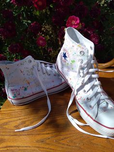 White Converse Shoes painted with some fun splashes of color then sealed with a professional shoe protectant.  The shoe sizes will only appear in men's but I will also do women sizes, let me know which one you want when ordering.I will take requests for the paint colors !! Converse High Tops Aesthetic, High Tops Aesthetic, Painted Converse High Tops, Shoes Painting, White Converse Shoes, Painted Converse, Professional Shoes, White Converse, Painted Shoes