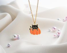 Cat on pumpkin necklace, Halloween Pumpkin Jewelry, Spooky Gothic Halloween Unique Handmade Jewelry 👻 This Halloween, elegance meets mystery with our Pumpkin Necklace! Available in silver or gold, it comes with an adjustable chain to match your personal style. 🌙 This stunning necklace combines a Gothic and minimalist design, offering a modern Halloween gift. Made from stainless steel, it's durable and pairs perfectly with any costume or daily wear. 🎃 Treat yourself or a loved one to the Pumpkin Necklace and highlight your elegance with this special accessory. It's a perfect gift option for a friend or a family member. 🕷️ Elevate your style this Halloween and create a mysterious expression with the Pumpkin Necklace. Order this limited-edition piece today and add a magical touch to your Cat On Pumpkin, Halloween Unique, Personalized Engraved Jewelry, Pumpkin Jewelry, Pumpkin Necklace, Boyfriend Personalized Gifts, Modern Halloween, Christmas Gifts For Grandma, Mother Daughter Gifts