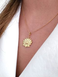 Elevate your style with our exquisite 14K Solid Gold Lotus Flower Necklace, a delicate and timeless piece that effortlessly combines elegance with a touch of nature. This dainty floral necklace is meticulously handmade, capturing the intricate beauty of the lotus flower, a symbol of purity and enlightenment. Perfect for yoga enthusiasts and meditation practitioners, this zen charm necklace exudes a sense of tranquility and balance. The minimalist design makes it a versatile accessory, suitable f Gold Flower Necklaces For Celebration, Elegant Flower Necklace For Celebration, Elegant Flower Shaped Necklace For Celebrations, Elegant 14k Gold Birth Flower Charm Necklace, Elegant Handmade Flower Charm Necklaces, Gold Spiritual Flower Necklace, Lotus Gold Pendent, 14k Gold Spiritual Flower Pendant Jewelry, Spiritual Lotus Flower Necklace For Meditation