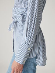 Featuring a timeless stripe pattern and a flattering wrap design, this blouse combines classic style with modern elegance. The structured fit and versatile look make it perfect for both professional and casual settings. Peplum Blouse, Wrap Blouse, Rebecca Taylor, Striped Blouse, Blue Blouse, Modern Elegance, Floral Blouse, Black Blouse, Silk Blouse