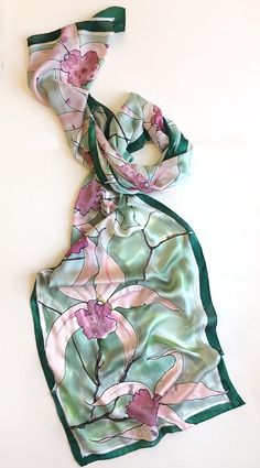 Hand painted Silk Scarf- Mint Orchids. Long elegant scarf painted in green pastel palette. Luxury gift for mom. Woman fashion shawls and scarves. Christmas gift woman. Wearable art. Pastel Minty green floral scarf is painted on silk satin 6. dimensions- 45 by 200 cm The hand painted scarf will be a unique gift for Christmas. ♥More Luxurious Scarves you can find here: https://www.etsy.com/shop/klaradar?ref=l2-shopheader-name§ion_id=18979710 ♥Made to order scarves: https://www.etsy.com/shop/klarad Textile Painting, Batik Scarf, Silk Scarf Design, Fabric Paint Diy, Elegant Scarf, Saree Painting, Fabric Painting On Clothes, Fabric Paint Designs, Hand Painted Scarves