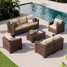 an outdoor patio furniture set near a swimming pool