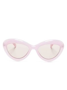 light pink acetate/acrylic translucent design cat-eye frame tinted lenses logo-embossed arm straight arms curved tips These glasses come with a protective case.