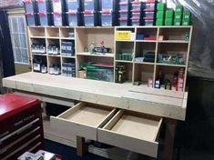 the workbench has many drawers and tools on it