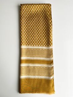 Inspired by the gold shops that span across the marketplaces of Palestine, we choose to incorporate this vibrant gold color into our traditional Palestinian Kefiyyah (Hatta), known to represent resistance. Made of the softest high quality natural fibers, we chose a lightweight blend that is 90% modal and 10% cashmere. Modal is a bio-based fabric that is made from spinning reconstituted beech tree cellulose and cashmere is the most luxurious wool that is both breathable and regulates our body tem Star Outline, Beech Tree, Border Pattern, Olive Leaf, Sample Sale, Body Heat, Natural Fibers, Gold Color, Shawl