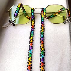 This handmade rainbow patterned glasses chain has been carefully designed and hand woven from the finest quality glass seed beads. It is a boho style sunglasses chain with glasses holder compatible with all your clothes, lightweight and easy to carry. Chain length: 80cm (31.5 inches) A unique 100% handmade light sun glasses chain that you can use in 4 seasons. It's not just an eyeglass leash  A multi-purpose chain that can also be used as a necklace, bracelet, mask chain. Guaranteed to receive a Colorful Adjustable Glass Beaded Necklaces, Multicolor Glass Beaded Necklaces With Adjustable Chain, Handmade Colorful Glass Beaded Necklaces, Colorful Handmade Glass Beaded Necklaces, Handmade Yellow Glass Beaded Necklace, Multicolor Beaded Chain Glasses Chains For Gifts, Multicolor Beaded Glasses Chain For Gift, Multicolor Beaded Glasses Chain As Gift, Multicolor Beaded Glasses Chains For Festival