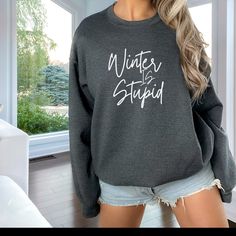 Cozy up with our 'Winter is Stupid' Sweatshirt, the perfect gift for your loved one who's not a fan of the cold. This sweatshirt isn't just warm; it's a lighthearted statement against winter's chill. Fight seasonal blues with humor, because who wouldn't want to bring back the sunshine? Gift comfort and a good laugh to combat the cold - a perfect remedy for seasonal grumbles. Gildan 18000. Ideal for any situation, a unisex heavy blend crewneck sweatshirt is pure comfort. These garments are made f Closet Addition, Teacher Wear, Fall Pullover, Cute Shirt Designs, Funny Shirts Women, Too Cold, Winter Sweatshirt, Fall Sweatshirt, Gift For Wife