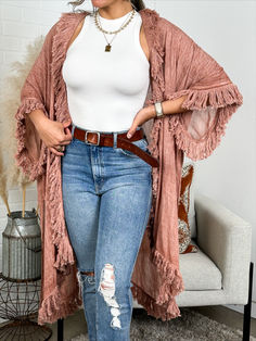 Add a touch of bohemian flair to any outfit with our Tulum Boho kimono Cardigan! Comfortable and elegant, this kimono cardigan is the perfect layering piece for any occasion. Embrace your free-spirited side and stand out in style. Summer Long Sleeve Outerwear With Fringe, Long Fall Cover-up For Day Out, Bohemian Spring Outerwear With Fringe, Bohemian Long Sleeve Kimono With Fringe, Spring Fringed Long Sleeve Kimono, Summer Poncho With Fringe, Summer Long Sleeve Poncho With Fringe, Chic Fall Cover-up For Layering, Spring Fringe Long Sleeve Kimono