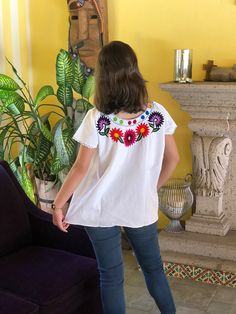 "Mexican floral embroidery blouse, with beautiful multicor embroidery, embroidered blouse to the front and back, fresh blanket blouse, ethnic blouse. This blouse is one size and fits M/L The embroideries of each blouse are unique so they may vary Mexican textile art has centuries of history and creativity throughout the country. Mexico is recognized as one of the leading countries with a beautiful aristic production in the textile world, miraculous hands of talented artisans from different state Folk Multicolor Embroidered Tops For Cinco De Mayo, Folk Style Multicolor Embroidered Top For Cinco De Mayo, Folk Style Tops With Geometric Embroidery For Fiesta, Multicolor Floral Embroidered Blouse For Fiesta, Bohemian Blouse With Multicolor Embroidery For Fiesta, Fiesta Multicolor Blouse With Floral Embroidery, Fiesta Tops With Floral Embroidery, Embroidered Fiesta Blouse, Cotton Embroidered Top For Fiesta