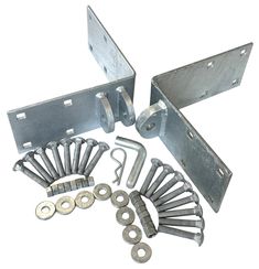 an assortment of metal parts are shown on a white background